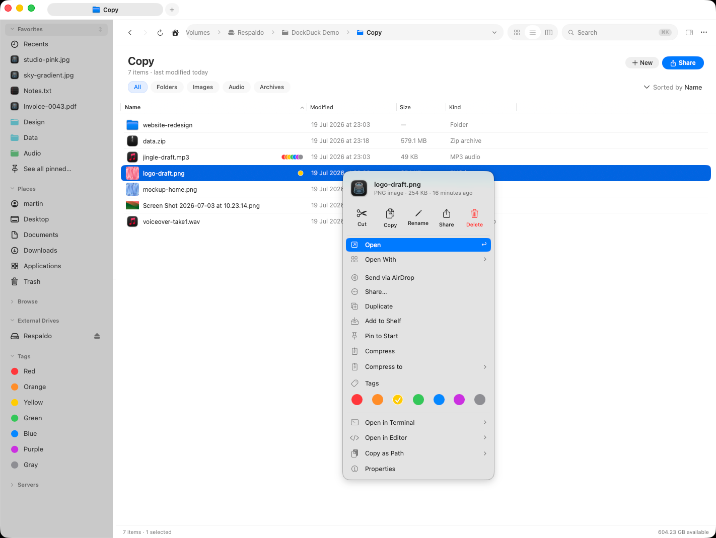 The right-click menu showing the row of colored tag dots, with tagged items showing inline color dots in the listing behind it